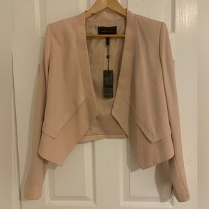 BCBG Maxazria original suit. Brand new, never worn. In excellent condition.